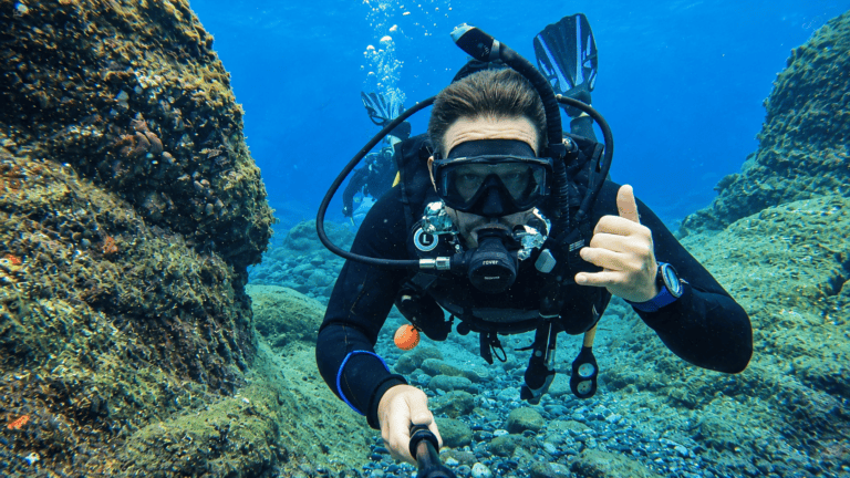 Scuba diver taking a selfie on a reef in Madeira