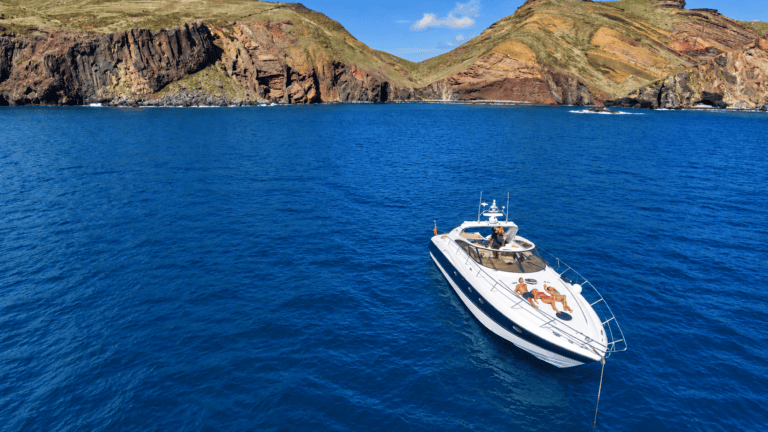 Private yacht sailing along the Madeira coastline