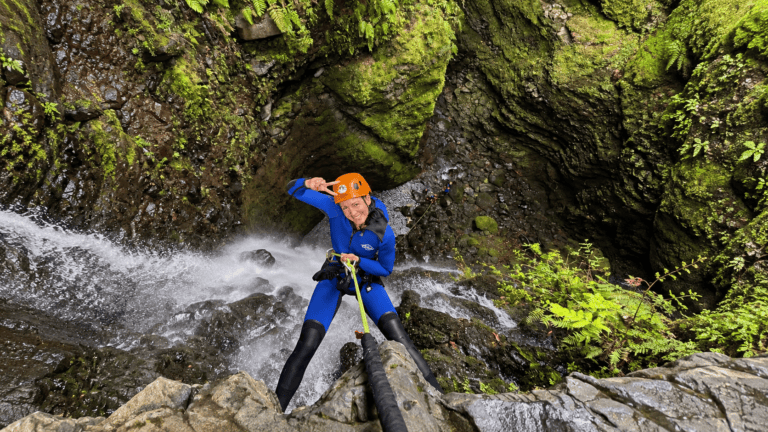 Canyoning through a waterfall in Madeira