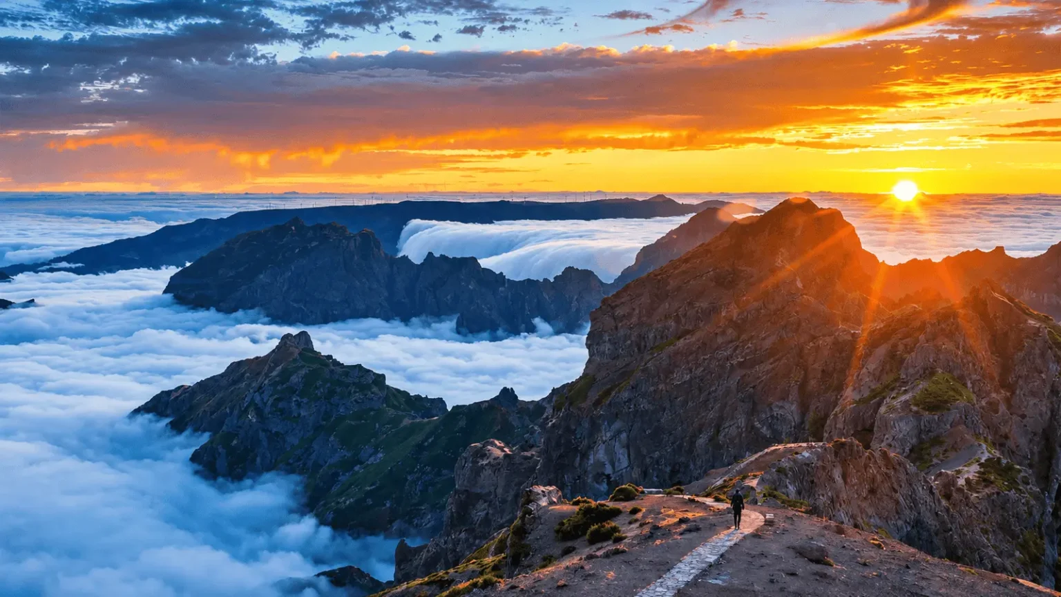 Sunrise above Madeira's mountain peaks and sea of clouds