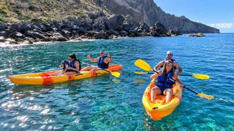 Sea kayaking in clear water along the Madeira coast
